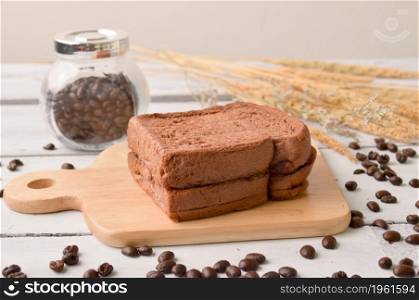 Coffee Bread and Coffee Bean for breakfast on wooden background