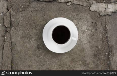 Coffee break. Conceptual image of cup of coffee on stone surface