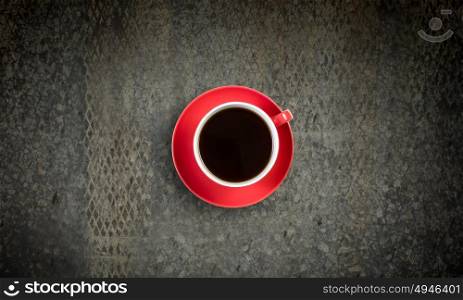 Coffee break. Conceptual image of cup of coffee on stone surface
