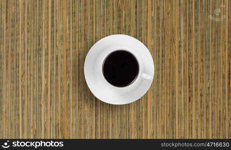 Coffee break. Conceptual image of cup of coffee on wooden table