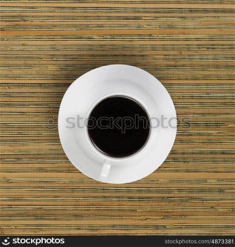 Coffee break. Conceptual image of cup of coffee on wooden table