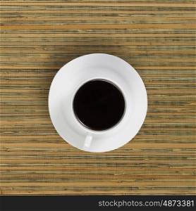Coffee break. Conceptual image of cup of coffee on wooden table