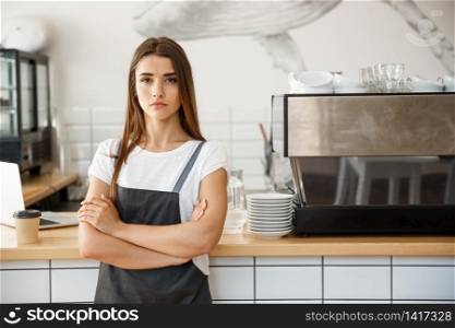 Coffee Business owner Concept - attractive young beautiful caucasian barista in apron with confident looking at camera in coffee shop counter.. Coffee Business owner Concept - Portrait of happy attractive young beautiful caucasian barista in apron with confident looking at camera in coffee shop counter.