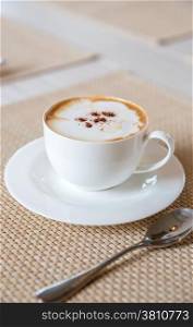Coffee cappuccino in white cup