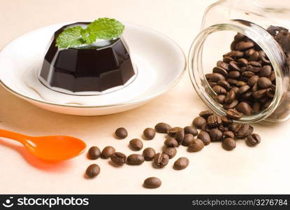 Coffee, coffee pudding and coffee beans in glass jar