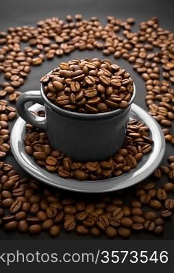 coffee composition of coffe grain and gray cup with grain