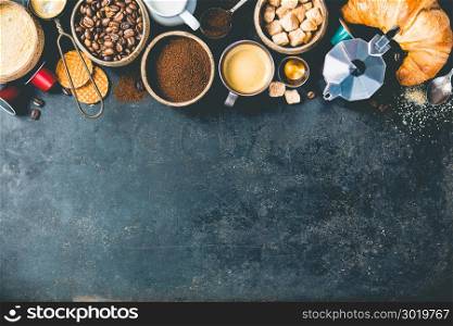 Coffee composition on dark background. Coffee espresso in dark cups, coffee beant, ground coffee, brown sugar, milk, croissants, capsules. Food frame concept. Flat lay