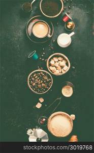 Coffee composition on dark background. Coffee espresso in dark cups, coffee beant, ground coffee, brown sugar, milk, croissants, capsules. Breakfast concept. Flat lay