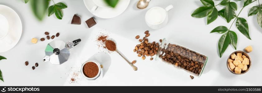 Coffee composition on light grey background, window shadow and green branches, flat lay, top view, banner