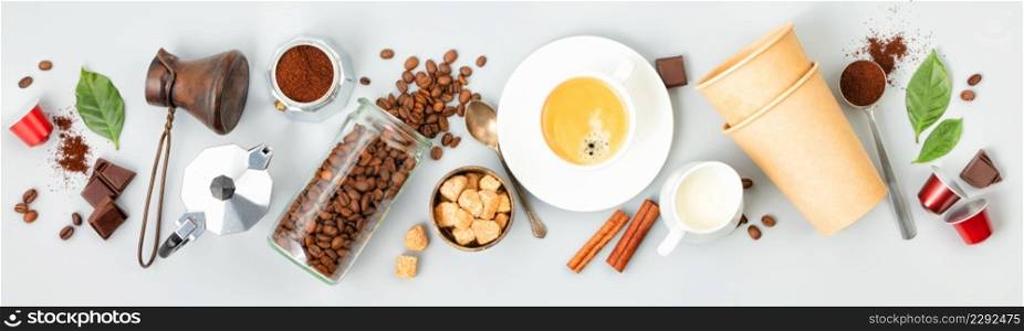 Coffee composition with coffee and accessories on white background, banner, top view
