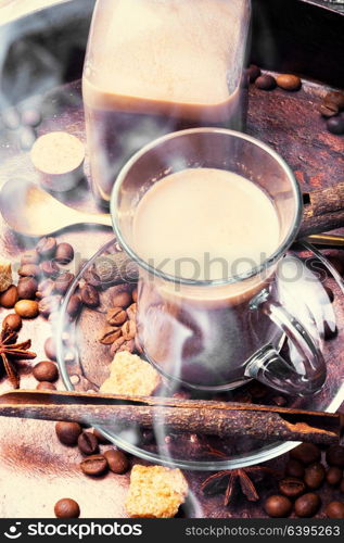 Coffee cup and beans on old copper background. Hot coffee cup with coffee beans