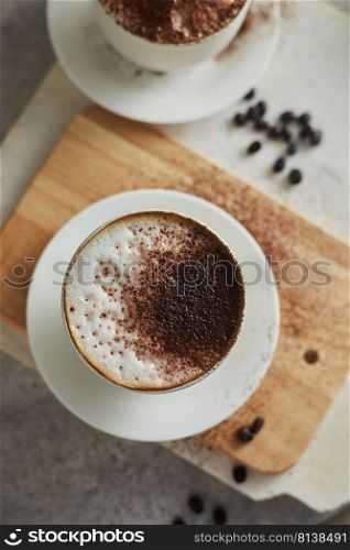 Coffee cup and coffee beans on table. 