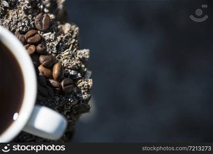 coffee Cup and coffee beans on wooden background.. coffee Cup and coffee beans on wooden background