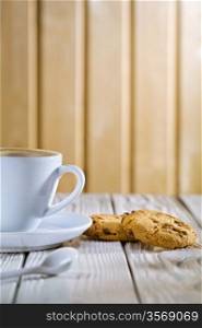 coffee cup and cookies on old white table