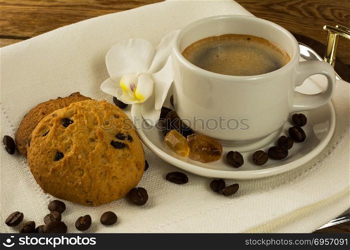 Coffee cup and cookies on the serving tray. Cup of coffee. Morning coffee. Coffee cup and cookies on the serving tray