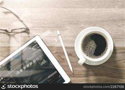 Coffee cup and Digital table dock smart keyboard,eyeglasses,stylus pen on wooden table,filter effect,icons screen