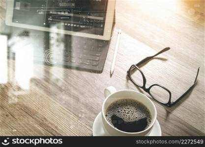 Coffee cup and Digital table dock smart keyboard,eyeglasses,stylus pen on wooden table,filter effect,icons screen