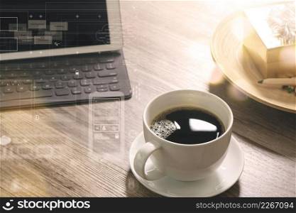 Coffee cup and Digital table dock smart keyboard,gold gift box and round wood tray,color pencil on wooden table,filter effect,icons screen