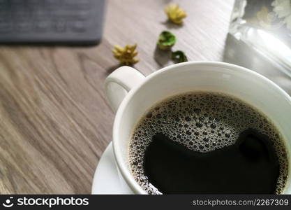 Coffee cup and Digital table dock smart keyboard,gold gift box and round wood tray,color pencil on wooden table,filter effect