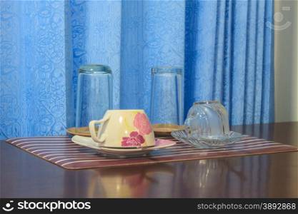 coffee cup and glass cup on wood table background