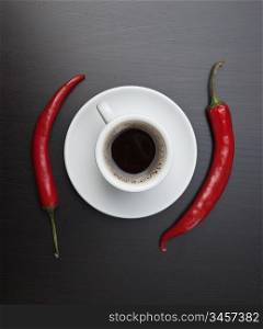 coffee cup and red chili peppers