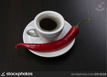 coffee cup and red chili peppers