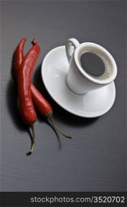 coffee cup and red chili peppers