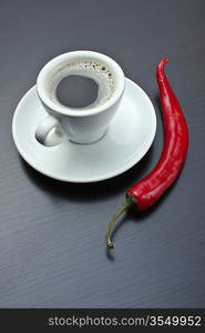 coffee cup and red chili peppers