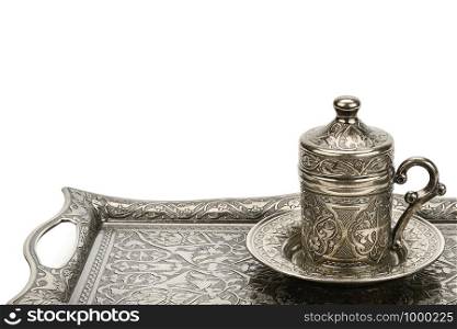 Coffee cup and tray with arabic decoration isolated on a white background. Free space for text.