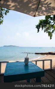 Coffee cup on the table. Beachfront restaurants at the beach.