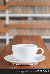 Coffee cup on wooden table, stock photo