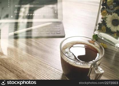 Coffee cup or tea and Digital table dock smart keyboard,vase flower herbs,stylus pen on wooden table,filter effect,icon screen
