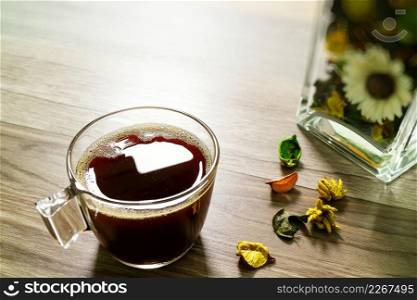 Coffee cup or tea ,glass vase dry flower herbs, on wooden table,filter effect,close up