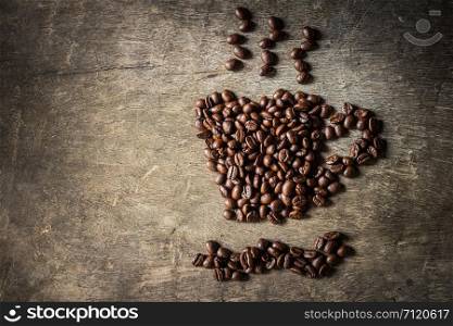 Coffee cup symbol made from coffee beans.