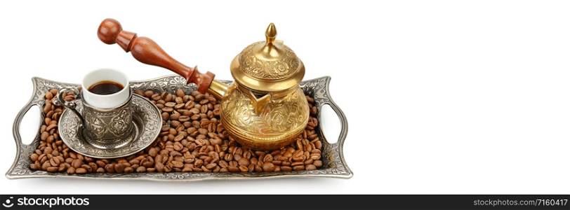 Coffee cup, tray with arabic decoration and coffeepot isolated on a white background. Free space for text. Wide photo .