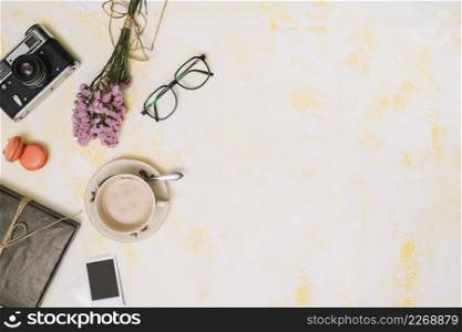 coffee cup with flowers bouquet camera glasses table