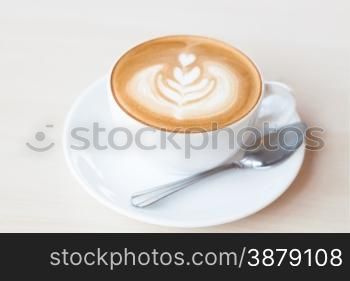 Coffee cup with latte art, stock photo