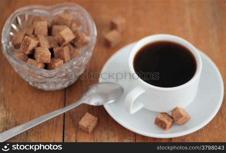 Coffee cup with lump sugar. Shallow depth of field.