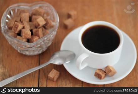 Coffee cup with lump sugar. Shallow depth of field.