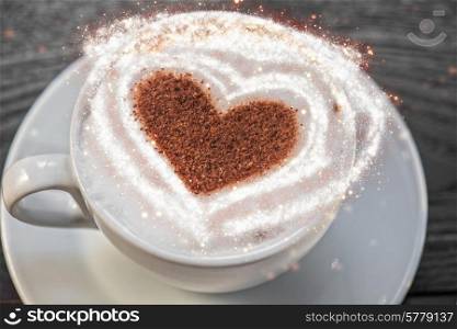 Coffee cup with milk and heart shape. Coffee heart shape