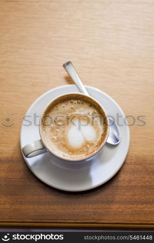 Coffee cup with milk on the table and copy-space