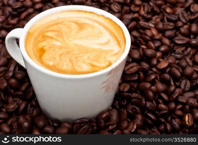 coffee cup with pattern on foam, closeup