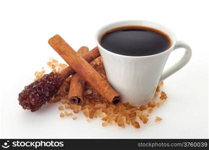 Coffee cup with sugar and cinnamon on white background