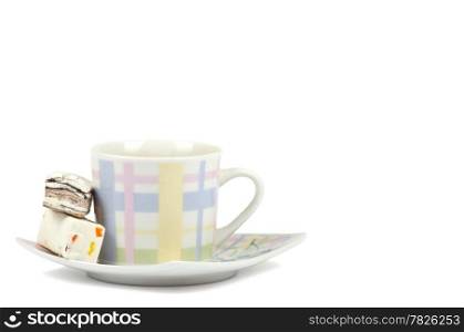 Coffee cup with sweets on white background