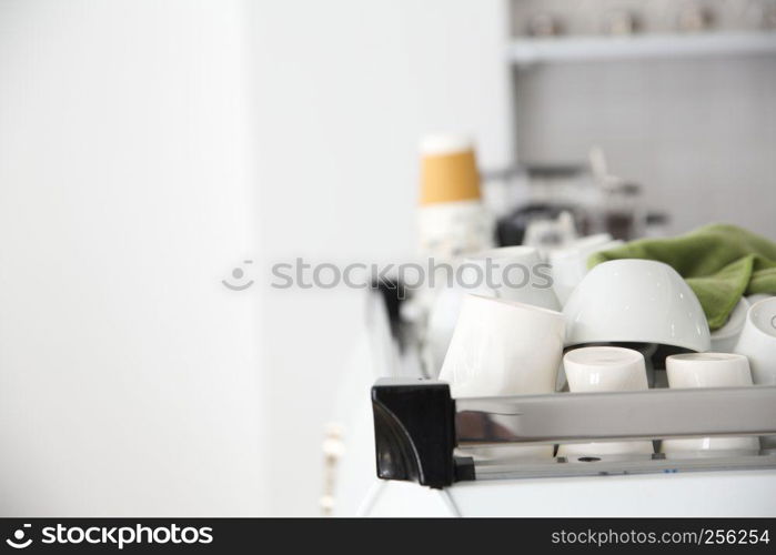 Coffee cups on Coffee machine in white coffeeshop