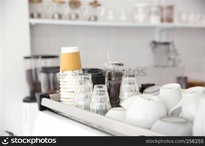 Coffee cups on Coffee machine in white coffeeshop