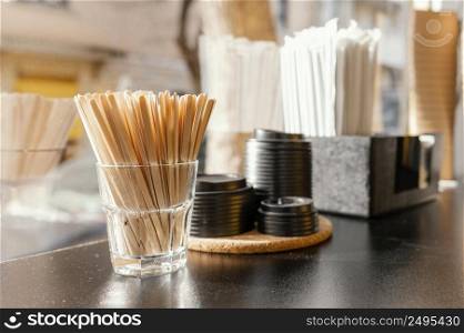 coffee cups with lids wooden sticks coffee shop counter