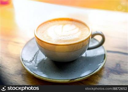 Coffee drink on wooden table with blur background