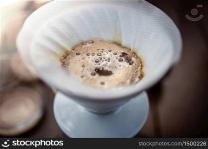 Coffee Drip Concept. Making Hot Drink at Home. Closeup shot