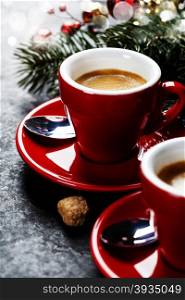 Coffee Espresso. Red Cups Of Coffee and Christmas decorations on dark background